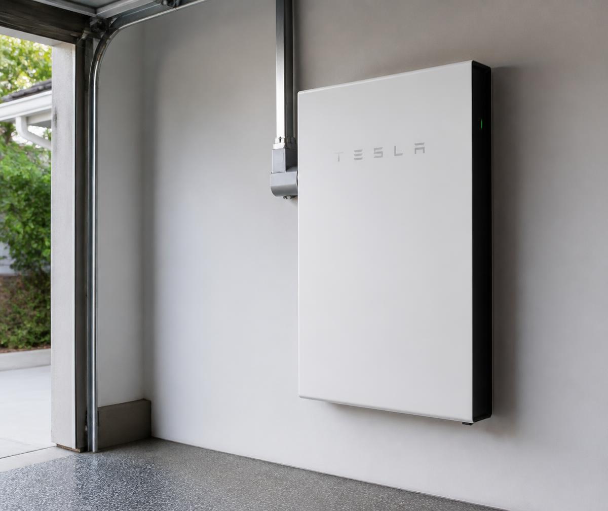 Home battery storage unit installed in a garage